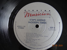 Load image into Gallery viewer, Steps Ahead − Michael Brecker, Warren Bernhardt, Peter Erskine, Eddie Gomez, Mike Mainieri : Modern Times (LP, Album)